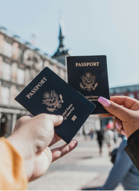 Travellers holding passports while visiting an international destination